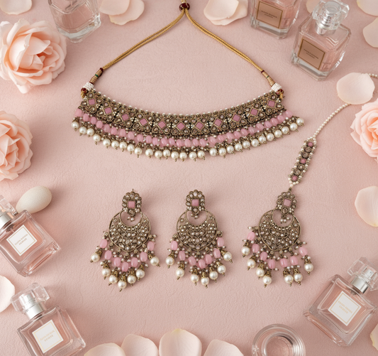Centered jewellery set with blush vanity background