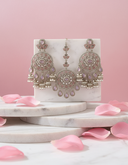Earrings & Tikka Set in Pastel Pink with elegant background