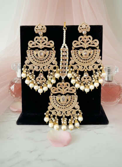 Gold Earrings and Tikka Set with Pink Background