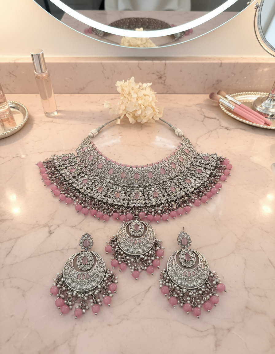 Jewellery on blush pink marble vanity