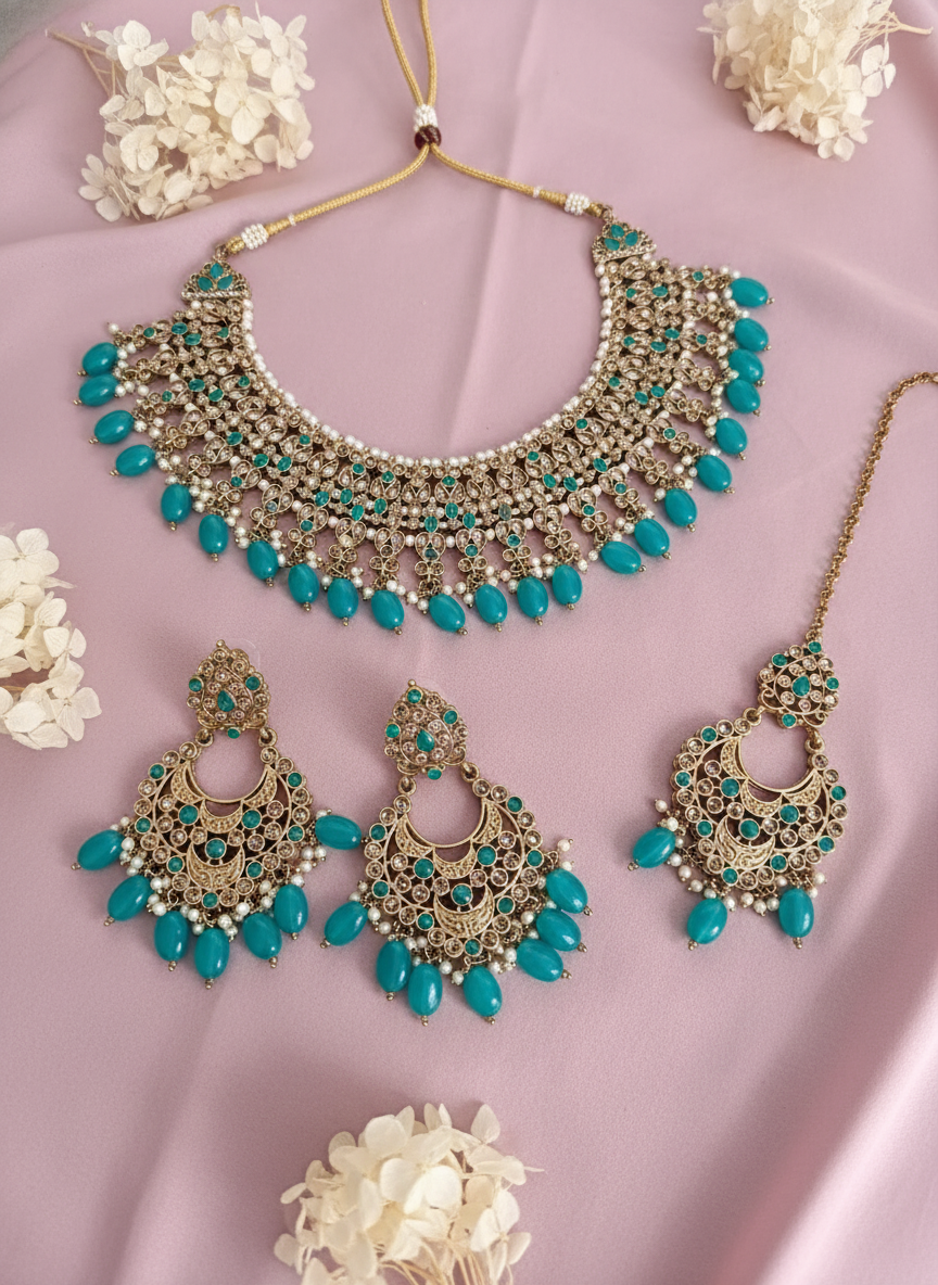 Jewelry set on dusty rose