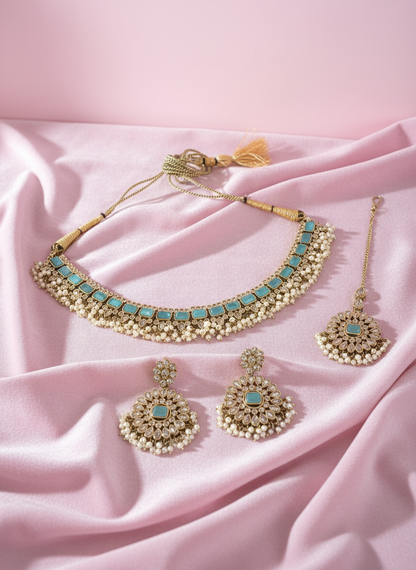 Jewelry set on pastel pink background
