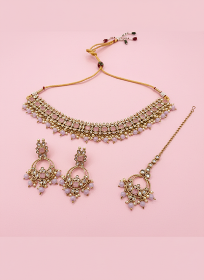 Jewelry set with pastel pink background