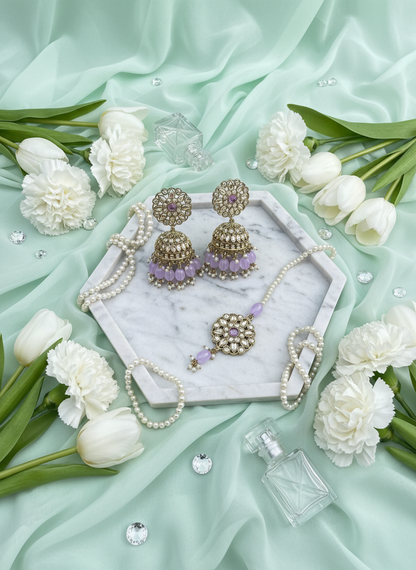 Purple kundan jewelry on mint chiffon with tulips