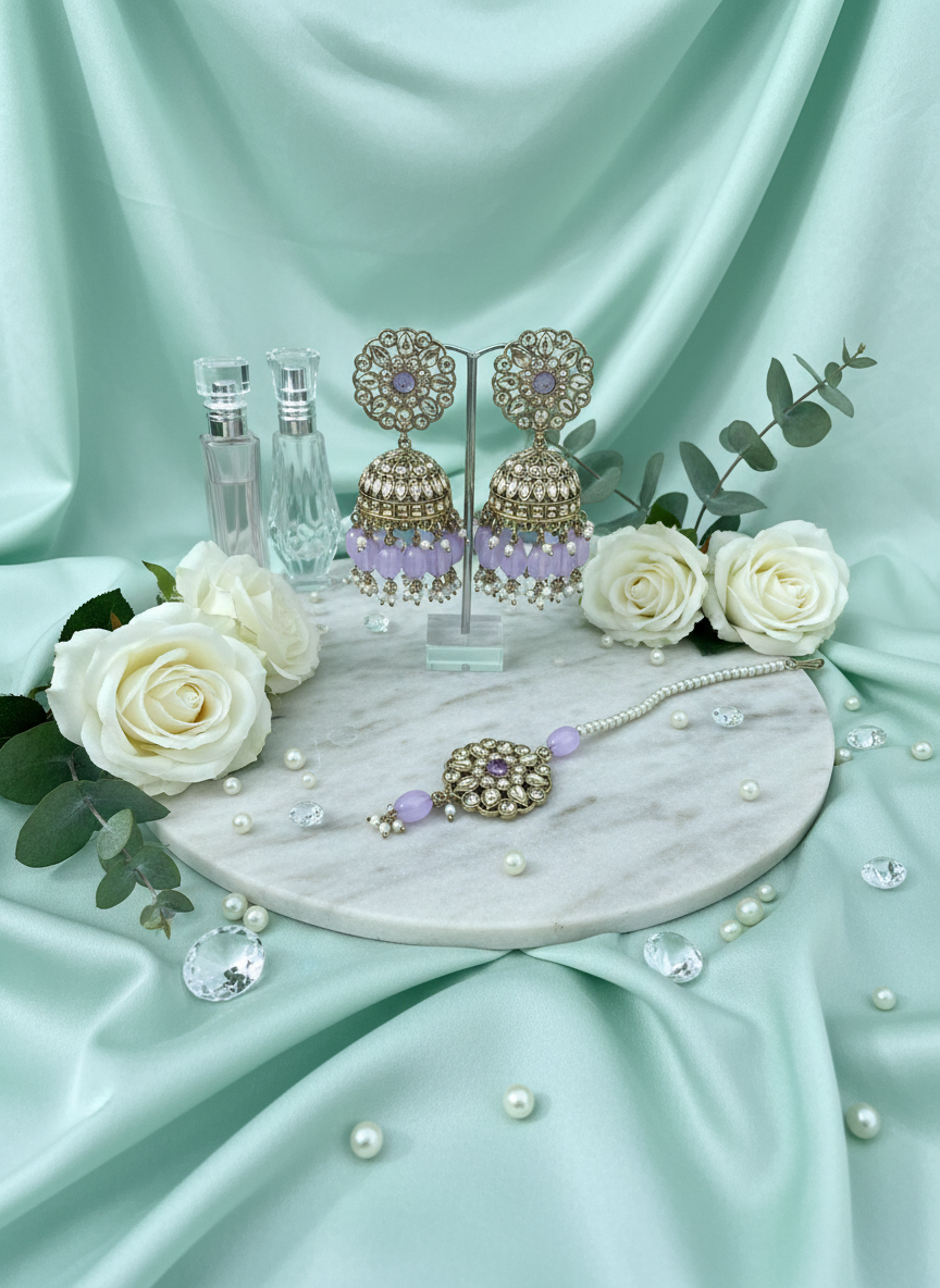 Purple kundan jewelry on mint silk with roses