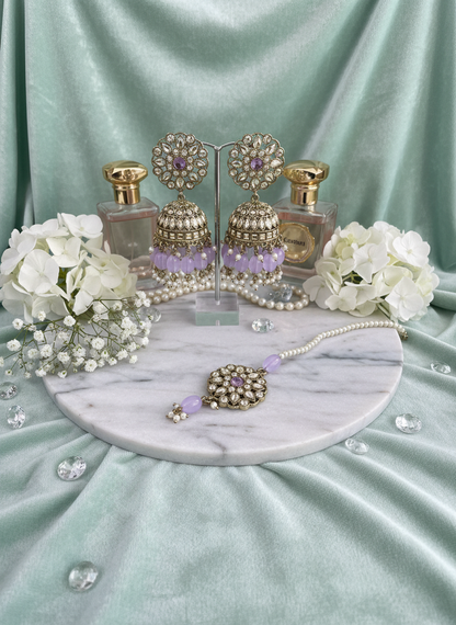 Purple kundan jewelry on mint velvet with hydrangeas