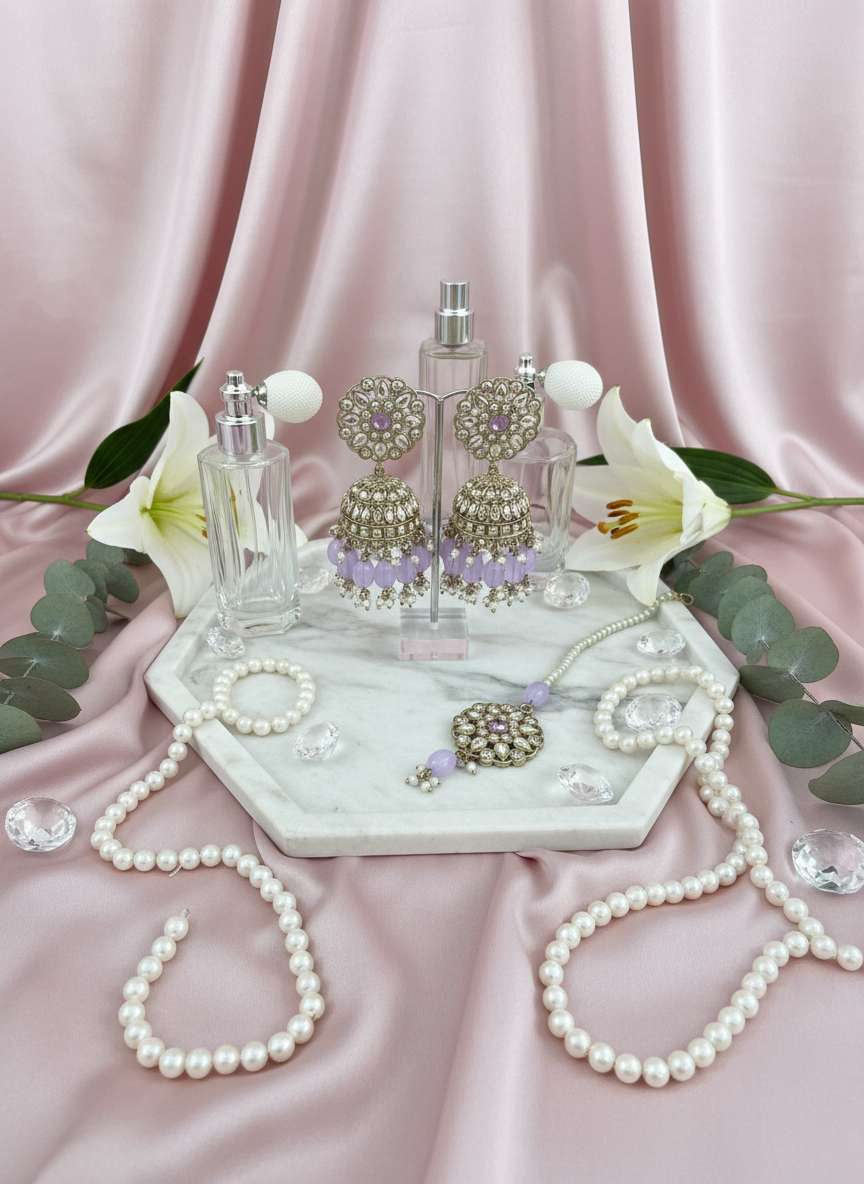 Purple kundan jewelry with lilies and silk