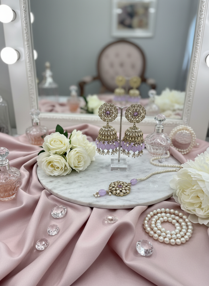 Purple kundan jewelry with roses and satin