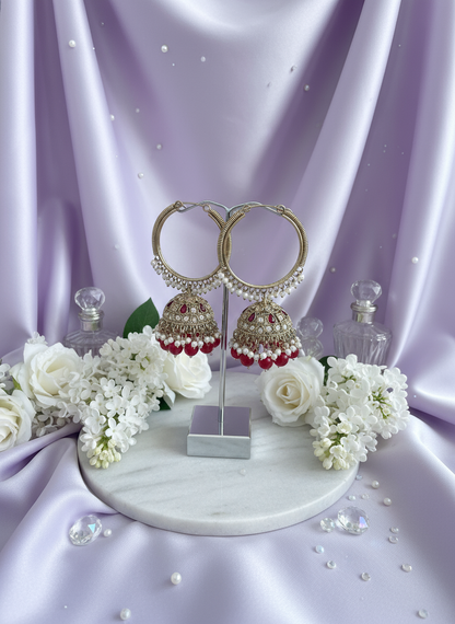 Red kundan bali earrings on pastel lavender