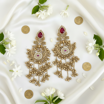 Ruby chandbali on ivory silk flat lay