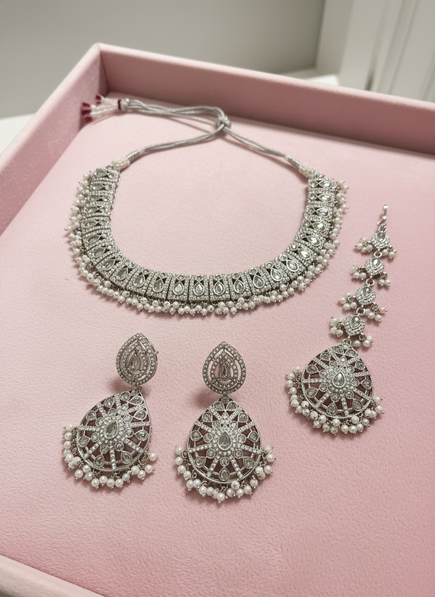 Silver Jewelry on Pink Background