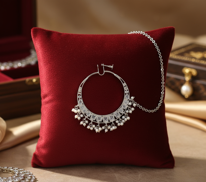 Silver nose ring centered on cushion