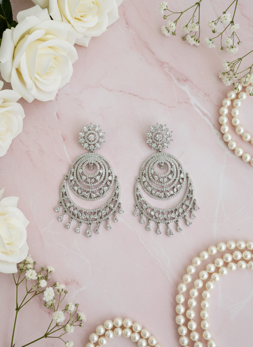 Statement chandbali earrings with pastel pink styling