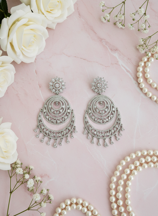 Statement chandbali earrings with pastel pink styling