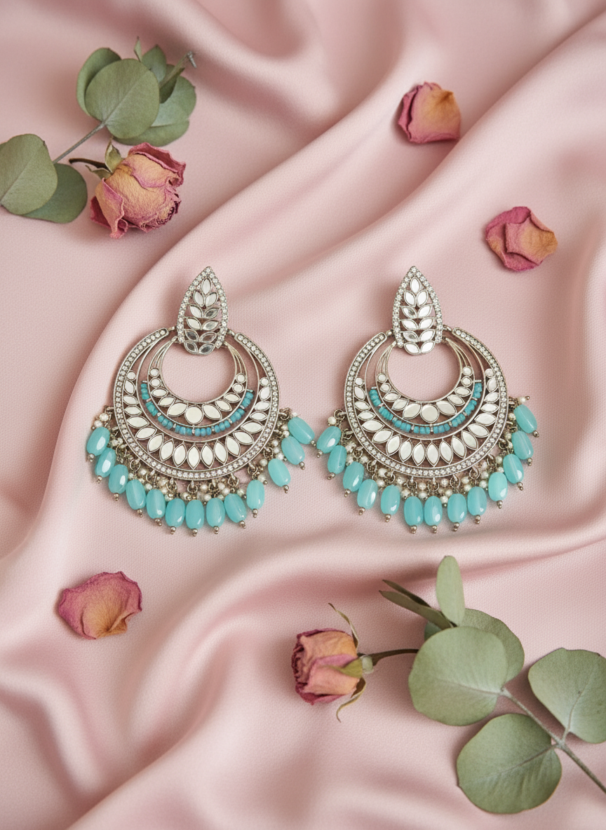 Turquoise jewelry with rose petals