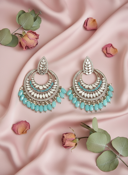 Turquoise jewelry with rose petals