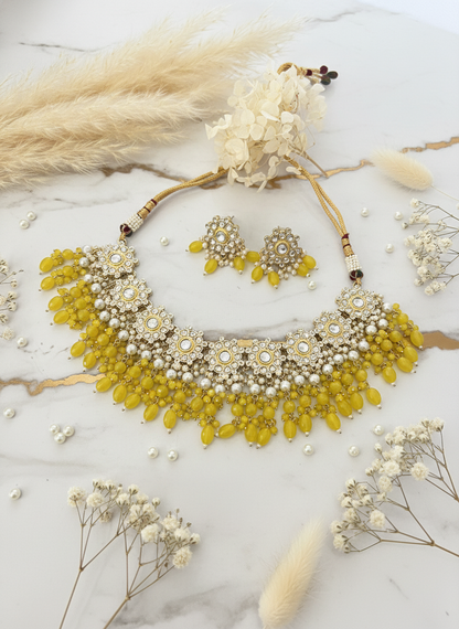 Yellow Jewelry on White Marble